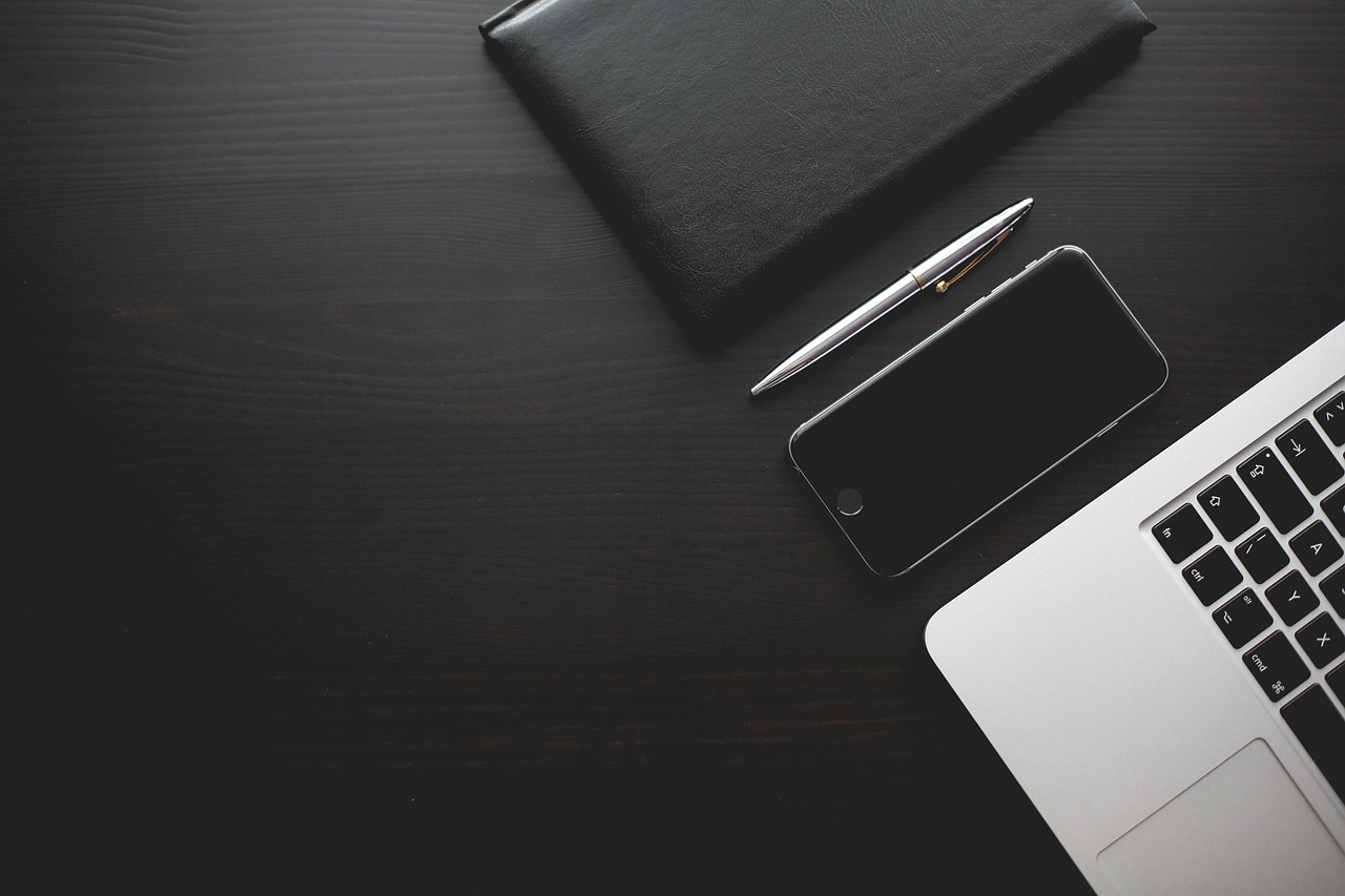 Office, desk, smartphone — Prosperity Home Delivers Home Loan Solutions Tailored to Your Needs